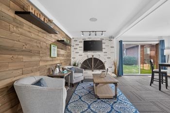 Community clubhouse with coworking lounge at drawbridge apartments in harrison township, mi.