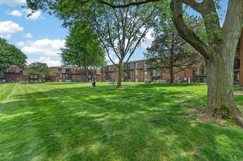 Expansive green space at drawbridge apartments in harrison township, mi.