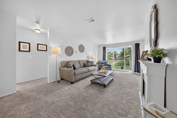 Harrison Township apartment for rent - Elevated living room and private balcony at Drawbridge Apartments in Harrison Township, MI.