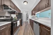 Southfield apartment for rent - Modern kitchen with stainless steel appliances at Franklin River Apartments in Southfield, MI.