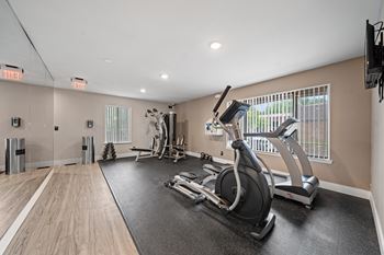 Updated 24-hour fitness and wellness center at knottingham apartments in clinton township, mi.