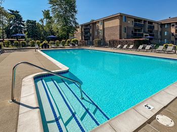 2 Heated swimming pools with sundecks at lakeside village apartments in clinton township, mi.