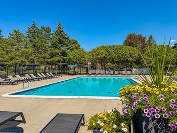 2 Heated swimming pools with sundecks at lakeside village apartments in clinton township, mi.