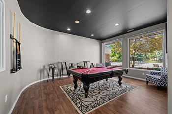 Community clubhouse with working lounge and billiards room at prentiss pointe apartments in harrison township, mi.