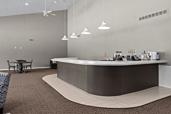 Community clubhouse with working lounge and billiards room at prentiss pointe apartments in harrison township, mi.