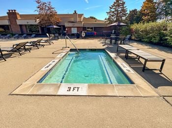 Heated pool and hot tub with sundeck at prentiss pointe apartments in harrison township, mi.