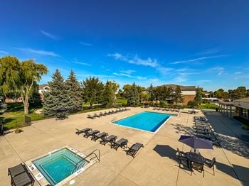 Heated pool and hot tub with sundeck at prentiss pointe apartments in harrison township, mi.