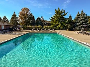 Heated pool and hot tub with sundeck at prentiss pointe apartments in harrison township, mi.