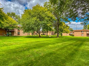 Expansive green space at westwood village apartments in westland, mi.