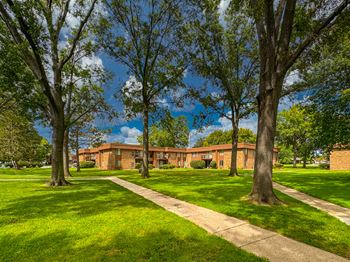 Expansive green space at westwood village apartments in westland, mi.