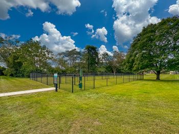 Spacious dog park at westwood village apartments in westland, mi.