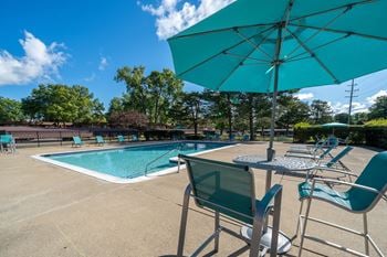 Two heated pools with sundecks at westwood village apartments in westland, mi.