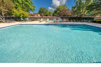 Two heated pools with sundecks at westwood village apartments in westland, mi.