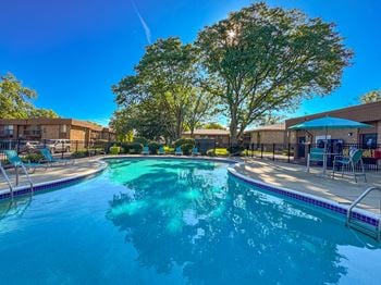 Two heated pools with sundecks at westwood village apartments in westland, mi.