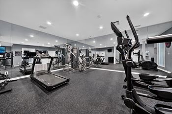 Updated 24-hour fitness and wellness center at westwood village apartments in westland, mi.
