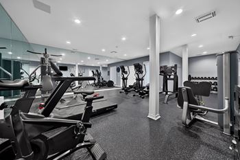 Updated 24-hour fitness and wellness center at westwood village apartments in westland, mi.