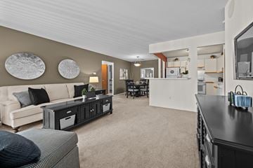 Southfield apartment for rent - A living room with a white couch and a black coffee table.