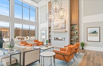 Roseville apartment for rent - a living room with orange furniture and a fireplace