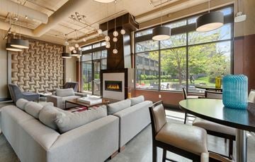 Minneapolis apartment for rent - a living room with couches and chairs and a fireplace