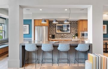 West St. Paul apartment for rent - a kitchen with a bar with four stools