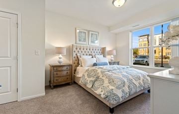 West St. Paul apartment for rent - a bedroom with a bed and a window