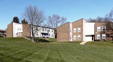 Iowa City apartment for rent - a group of brick apartment buildings on a hill