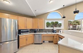 Port Richey apartment for rent - a kitchen with wooden cabinets and stainless steel appliances