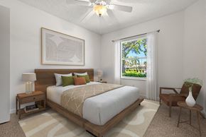 Port Richey apartment for rent - a bedroom with a large bed and a ceiling fan