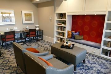 Coon Rapids apartment for rent - a living room with furniture and a red wall