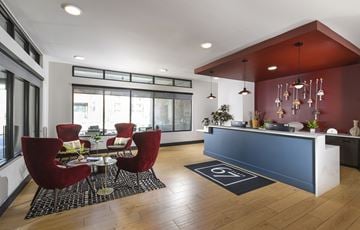 Glendale apartment for rent - A modern living room with a dining table and chairs.