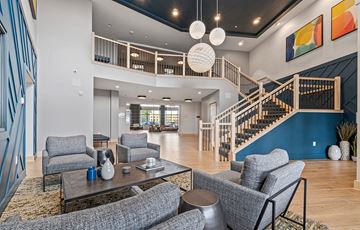 New Brighton apartment for rent - a living room with couches and chairs and a staircase