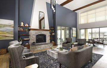 Phoenix apartment for rent - a living room with couches and chairs and a fireplace