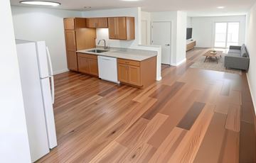 Buckeye apartment for rent - A kitchen with wooden floors and white appliances.