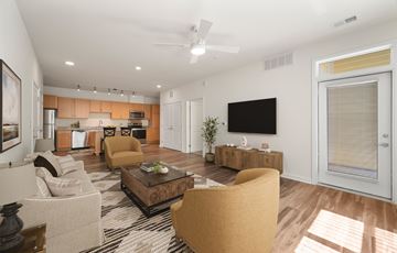 Charlotte apartment for rent - A living room with a brown sofa and a coffee table.