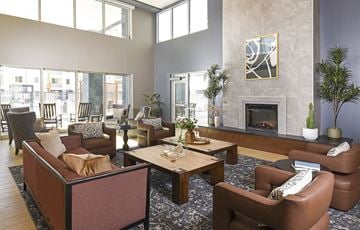 Glendale apartment for rent - A living room with a fireplace and a painting on the wall.