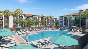 Kissimmee apartment for rent - A pool area with people relaxing and a building in the background at Maison at Solivita Marketplace Apartment Homes, Kissimmee, Florida
