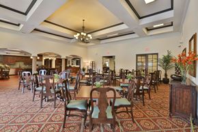 Burleson apartment for rent - a dining room with tables and chairs in a lobby at Cedars of Elk Drive 55+ Apartments, Texas, 76028