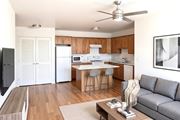 Vero Beach apartment for rent - A modern kitchen with a dining table and a grey sofa.
