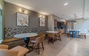 Union City apartment for rent - A modern dining room with a stone backsplash and wooden furniture.