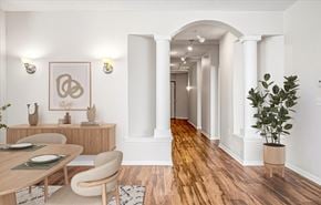 St. Anthony apartment for rent - A dining room with a wooden table and chairs.