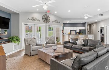 Mount Juliet apartment for rent - A living room with a grey couch and a wooden table.