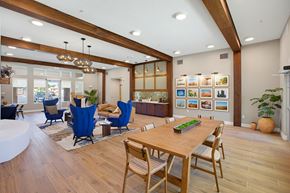 Rio Rancho apartment for rent - A modern dining room with a wooden table and chairs.