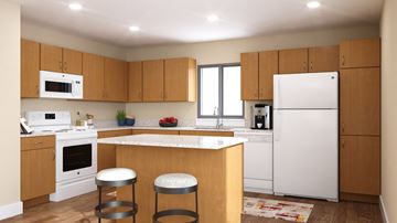 Surprise apartment for rent - A kitchen with white appliances and wooden cabinets.