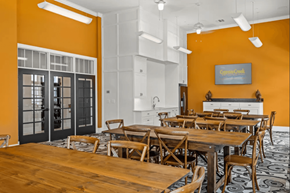 Waxahachie apartment for rent - a dining room with tables and chairs and a kitchen at Five 49 at River Oaks, Texas, 75165