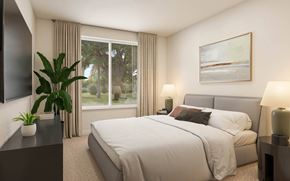 Apopka apartment for rent - A bedroom with a large bed, a plant, and a painting on the wall at The Mira Apartments, Florida, 32712