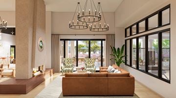 Surprise apartment for rent - A modern living room with a brown sofa and a large window.