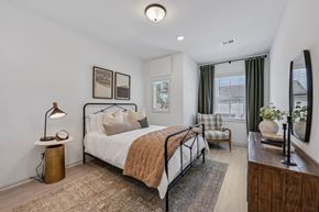 Dawsonville townhouse for rent - A bedroom with a large bed and a window with curtains.