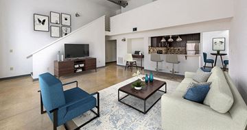 Atlanta apartment for rent - A living room with a blue chair and a white couch.