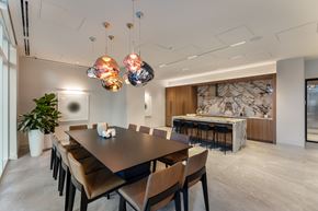 Coquitlam apartment for rent - A modern dining room with a large table and chairs.