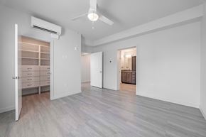 Jarrell apartment for rent - A spacious room with a ceiling fan and a cabinet with drawers.
